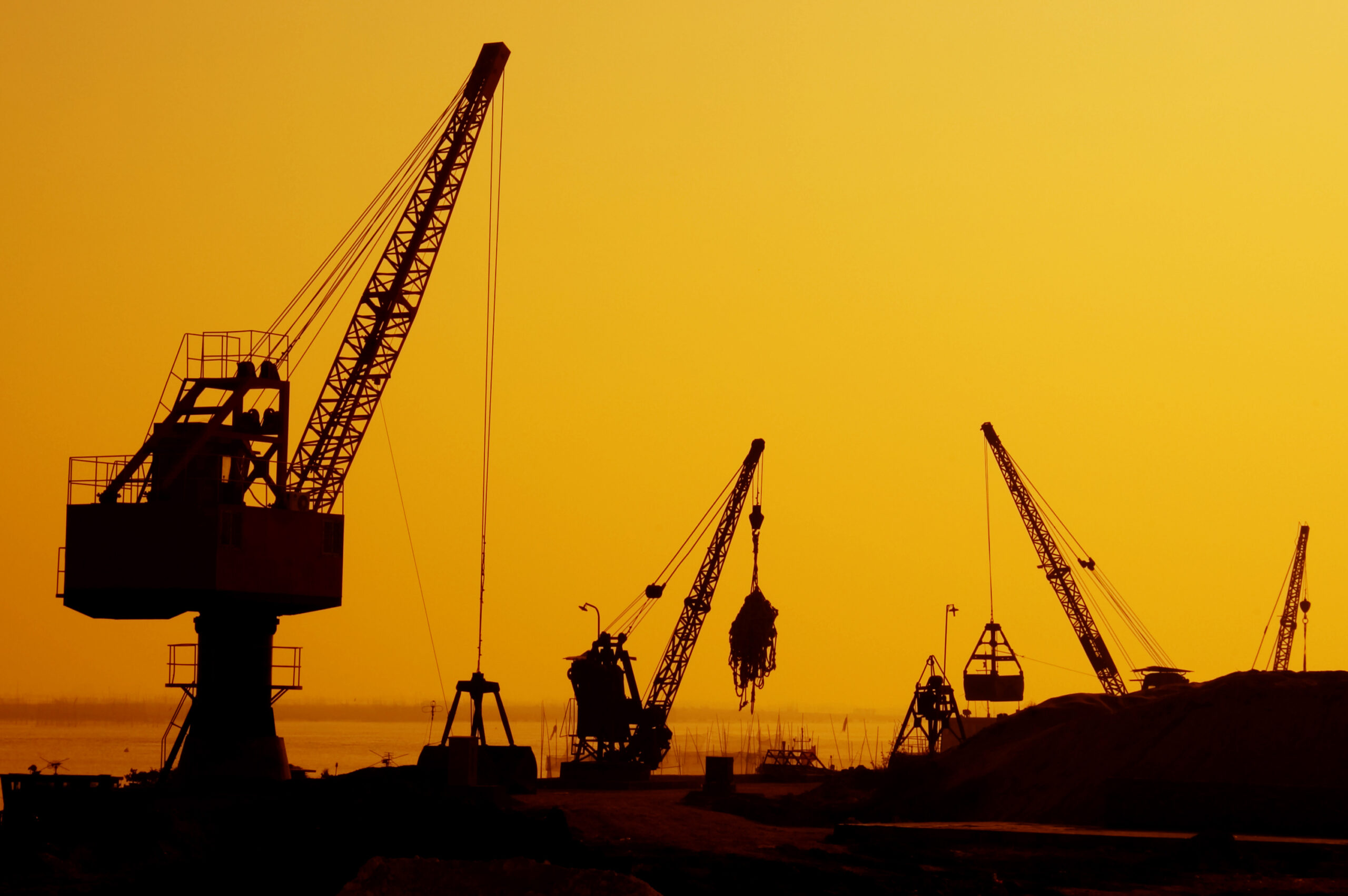 Construction of a major housing project at sunset.